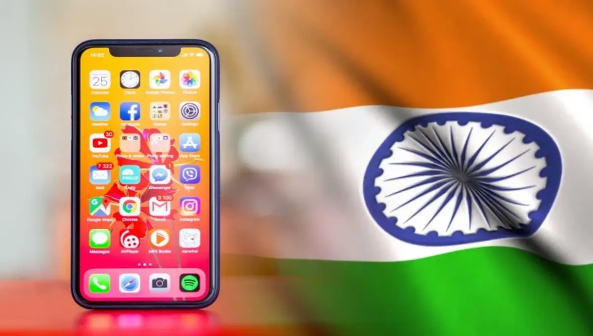 Apple iPhone production line in India with workers assembling devices, highlighting Tim Cook’s announcement on U.S. sales shift and Apple’s global manufacturing strateg